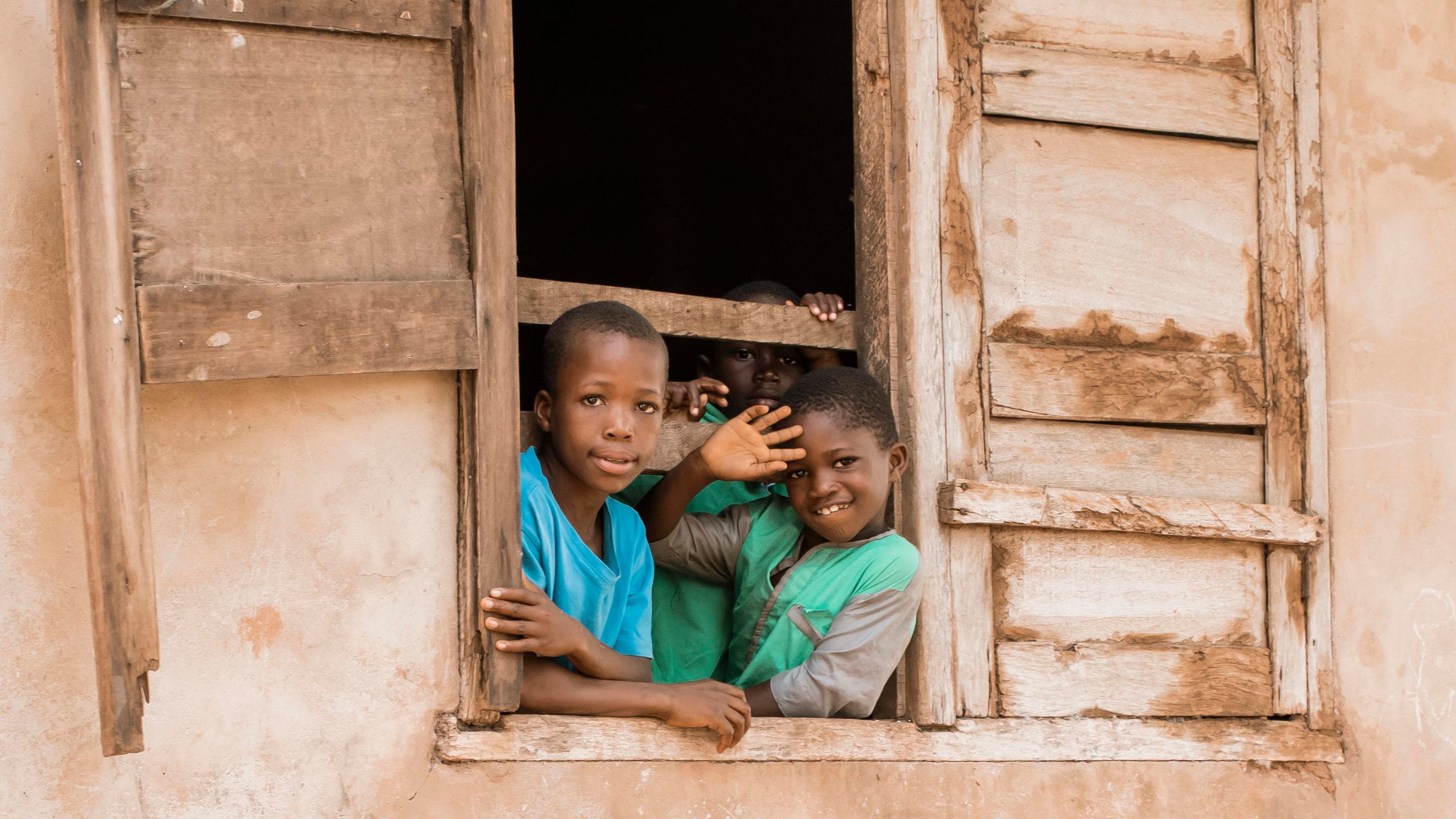 Children studying with books in a classroom